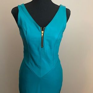 Leather 1980s turquoise dress with front zipper detail and cut our back